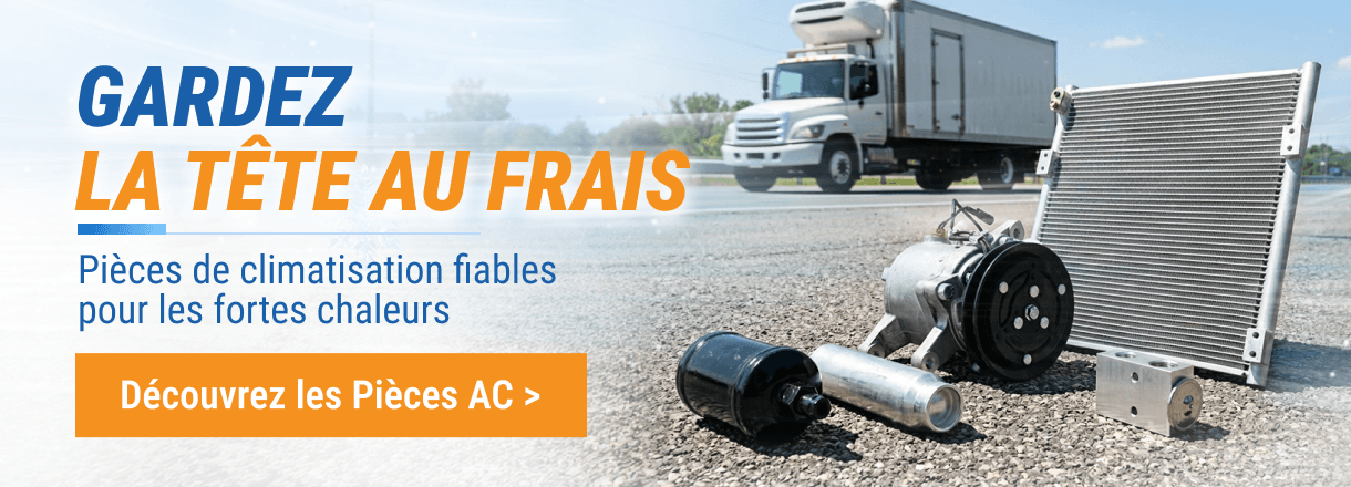 Pièces de climatisation FridayParts sur asphalte devant un camion en été.